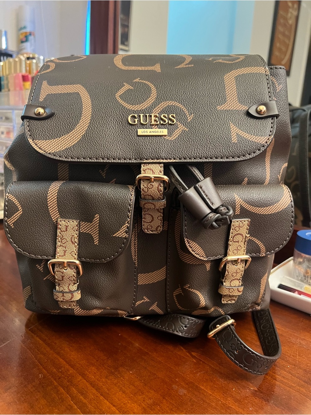 GUESS Brown and Tan Logo Backpack with Front Buckle Pockets